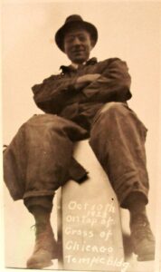 Unidentified man sitting atop the Temple cross October 10, 1923 